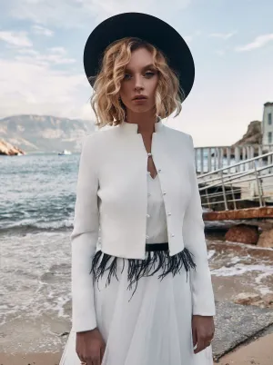 Knitted bridal cardigan with buttons and collar.